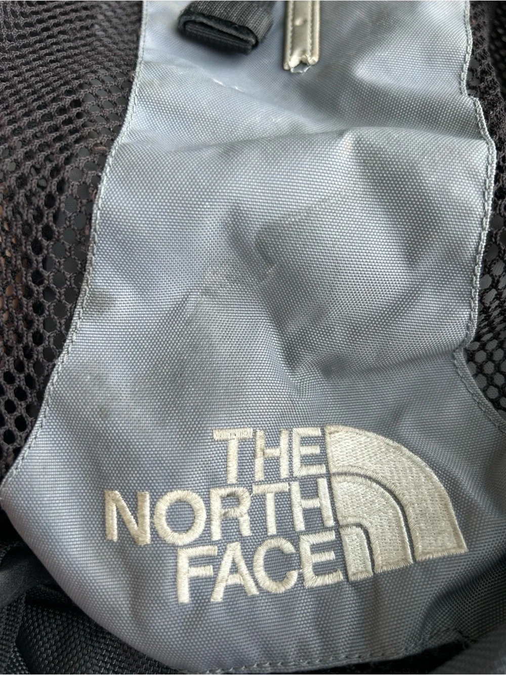 The North Face Gray and Black Backpack with Mesh Pockets